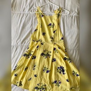 Yellow sundress with open back and sides
